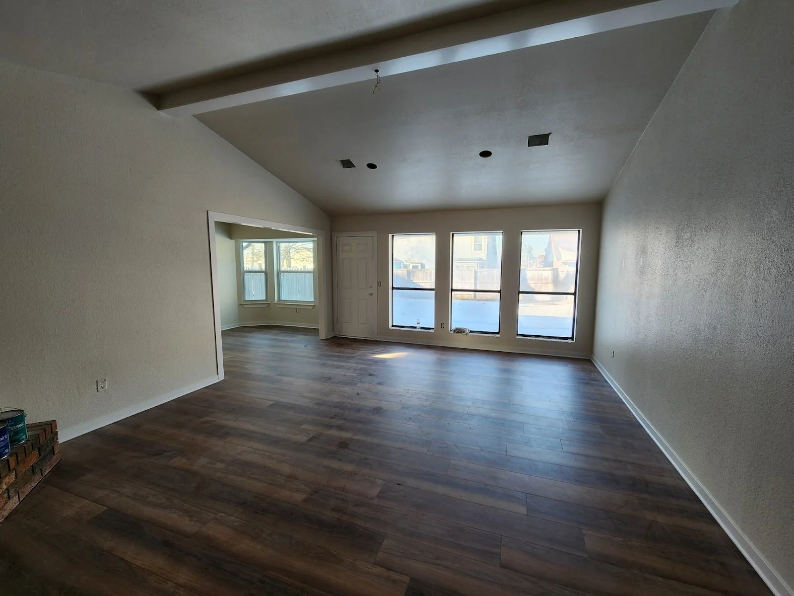 Freshly painted walls and ceiling in an open room after a complete interior repaint in Broken Arrow