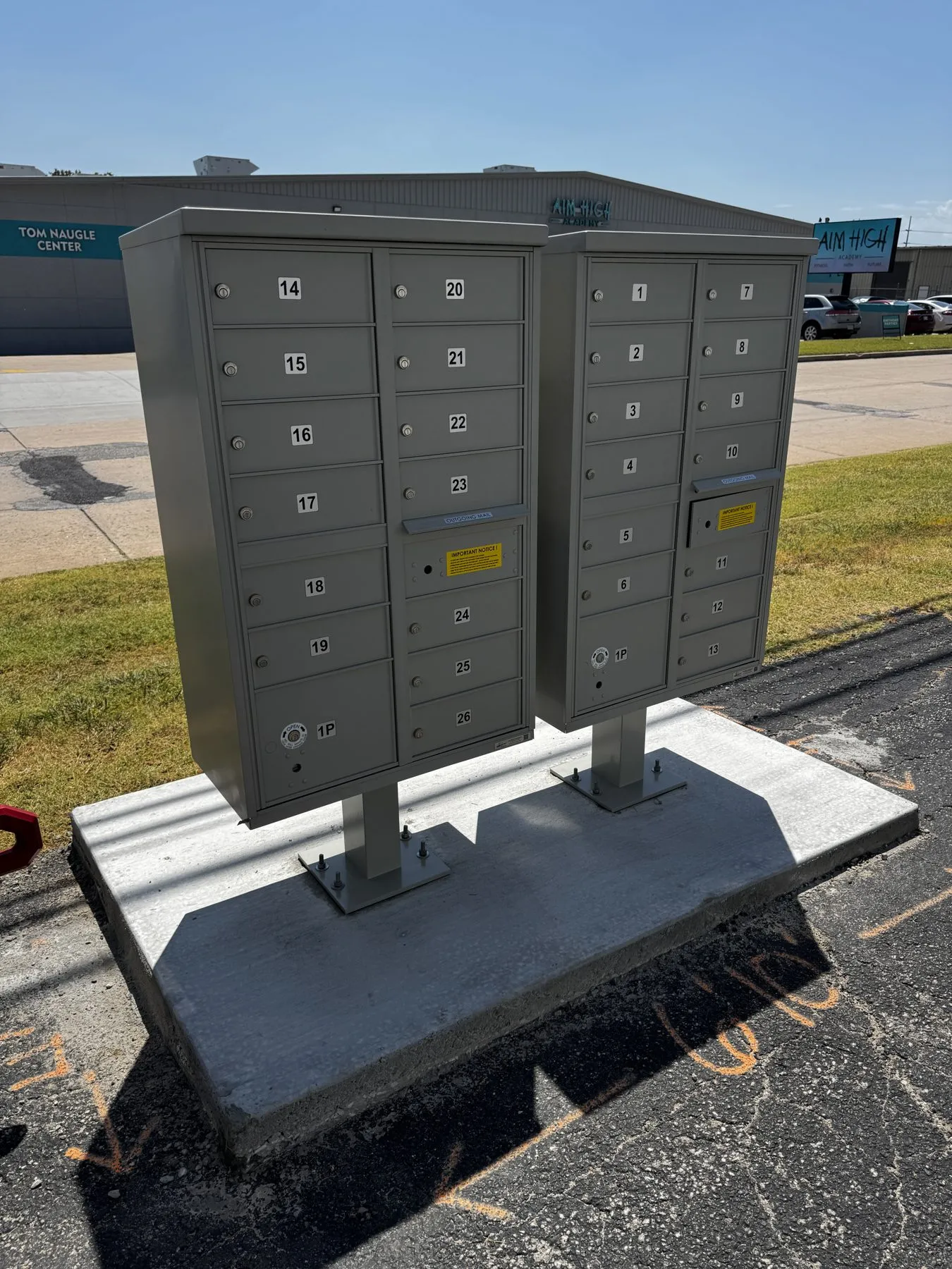 Cluster mailboxes mounted on a new concrete pad poured by Wiser & Sons Construction